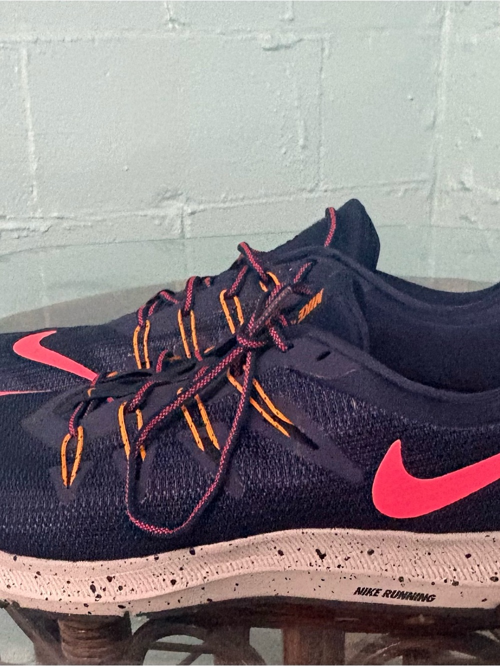 Nike Black Running Shoes with Pink Swoosh and Orange Accents